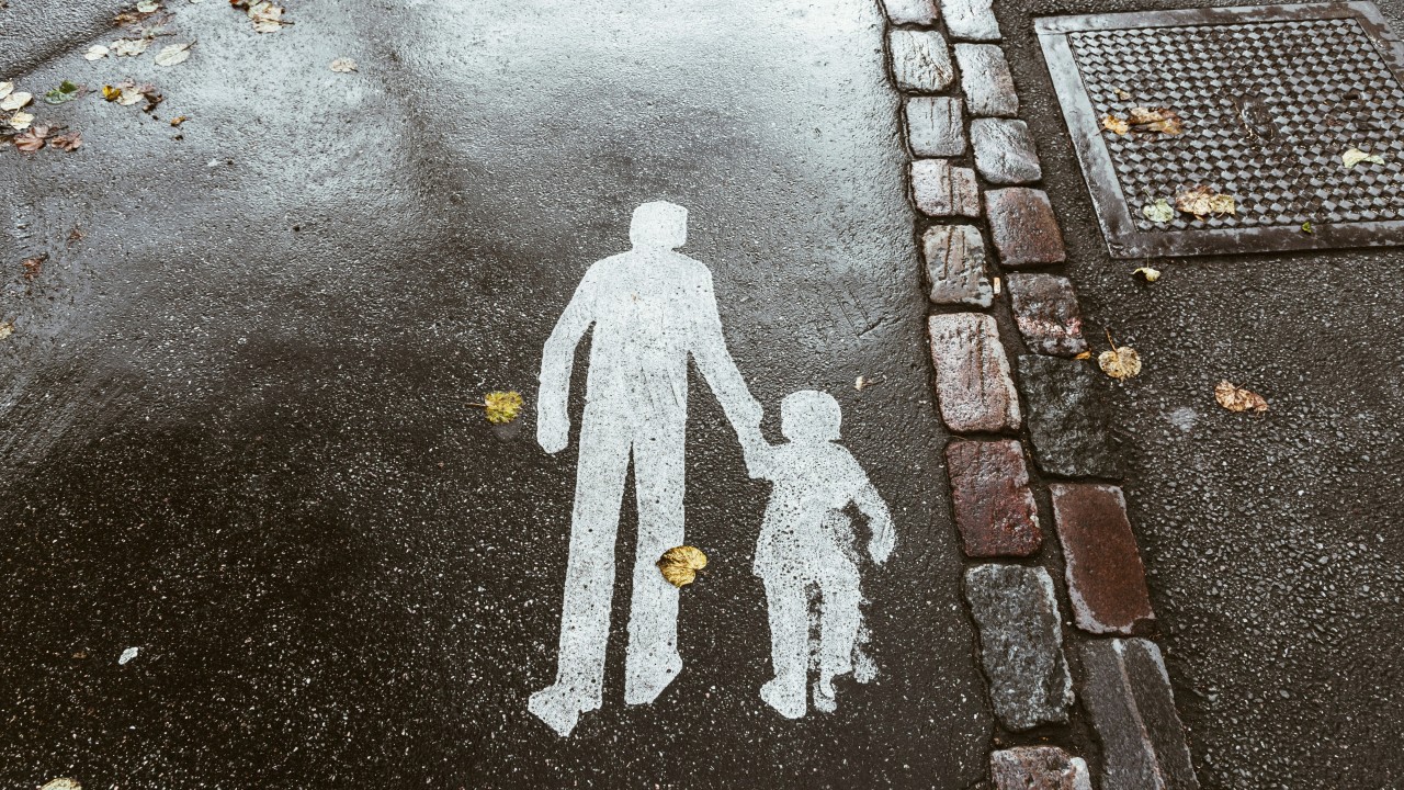 Sidewalk markings on a rainy day in Helsinki.
