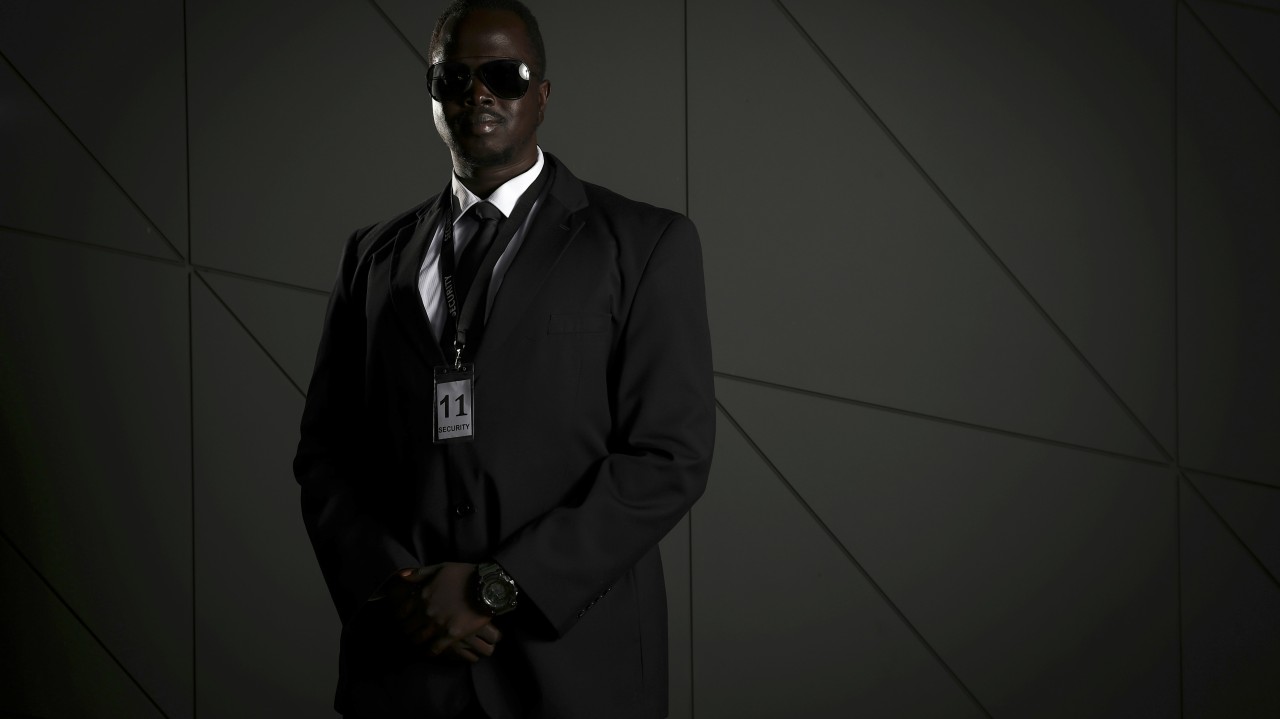 Man in Black Suit Wearing Black Sunglasses